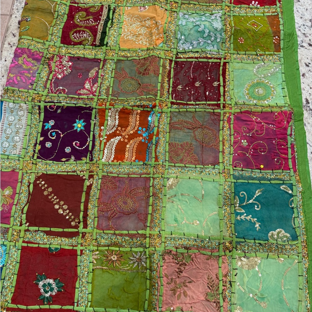 Colorful Patchwork Quilt with Embroidered Details